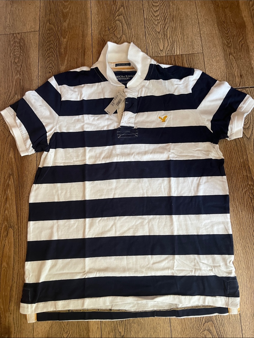 American Eagle Outfitters Navy and White Striped Polo with Yellow Logo